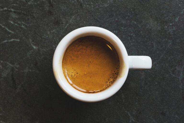 white ceramic mug fill with coffee